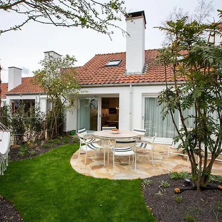 'a Little White House With A Tree By The Sea' With By Bloss